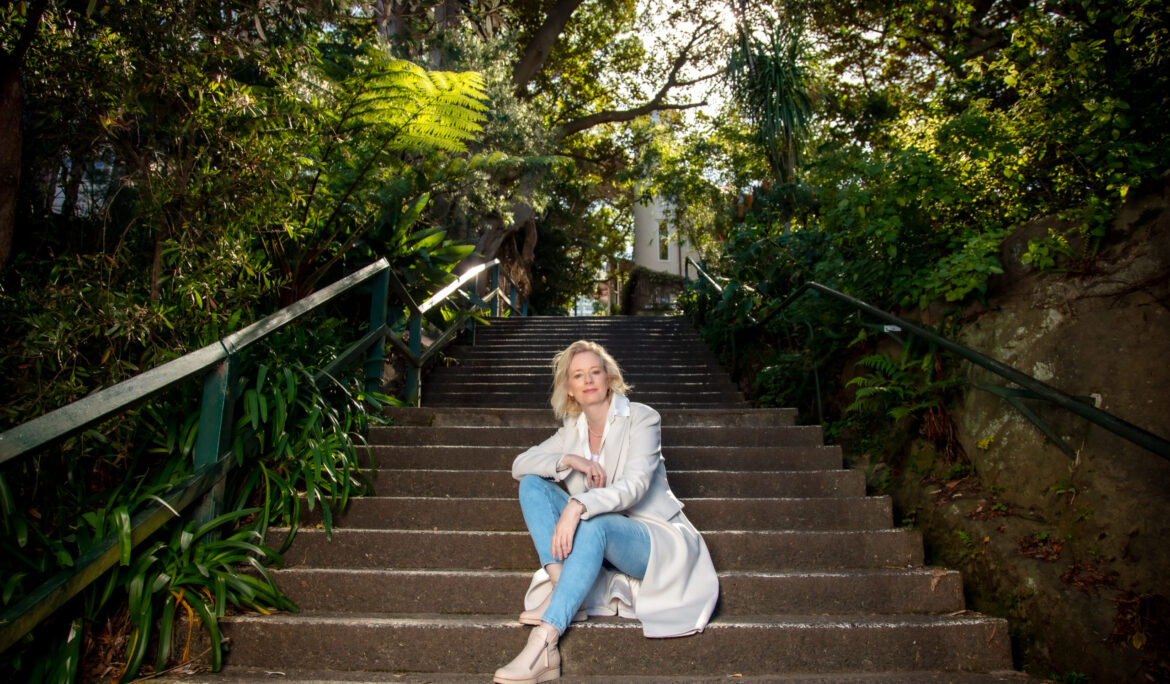 a woman sitting on garden stairs